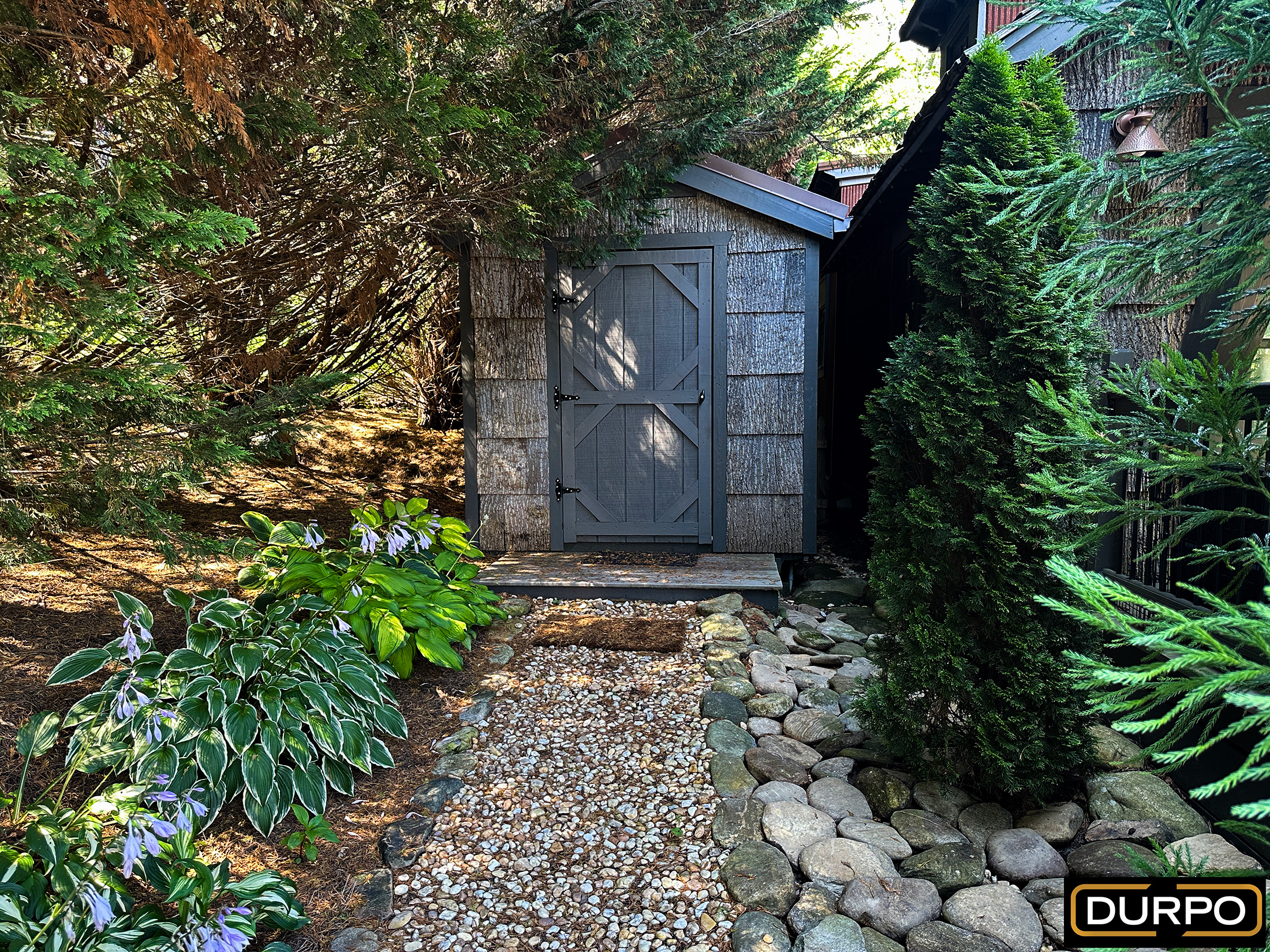 a small shed in a garden