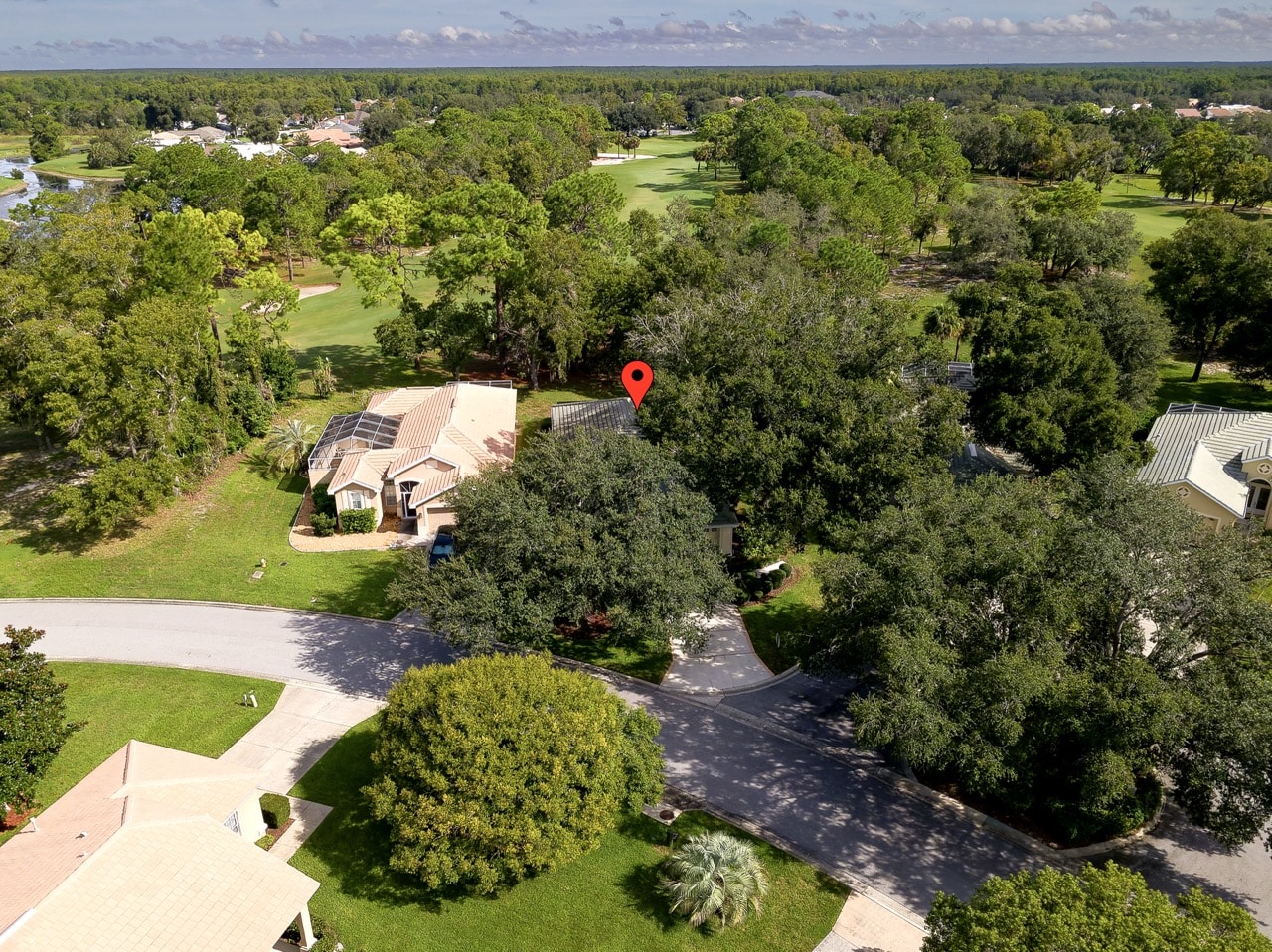 Aerial view of 9029 Penelope Dr on the 18th fairway in Glen Lakes Weeki Wachee